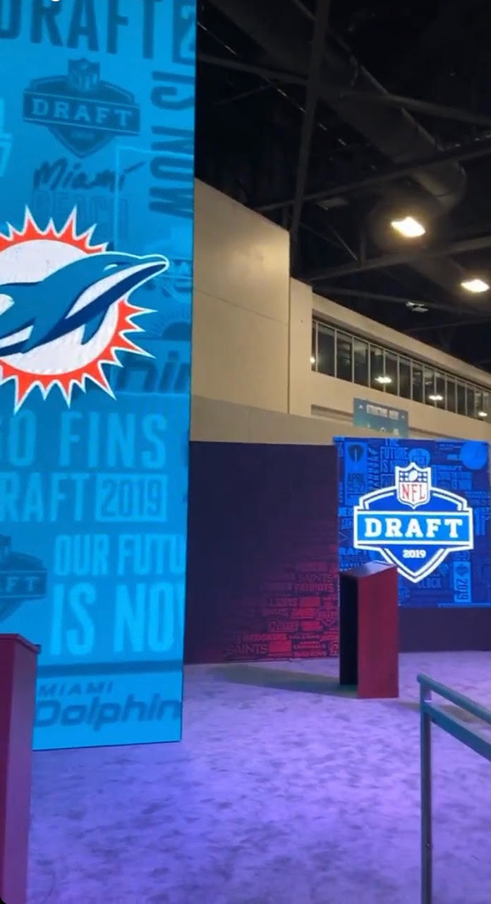 NFL Draft Stage with Miami Dolphins Logo in the Background